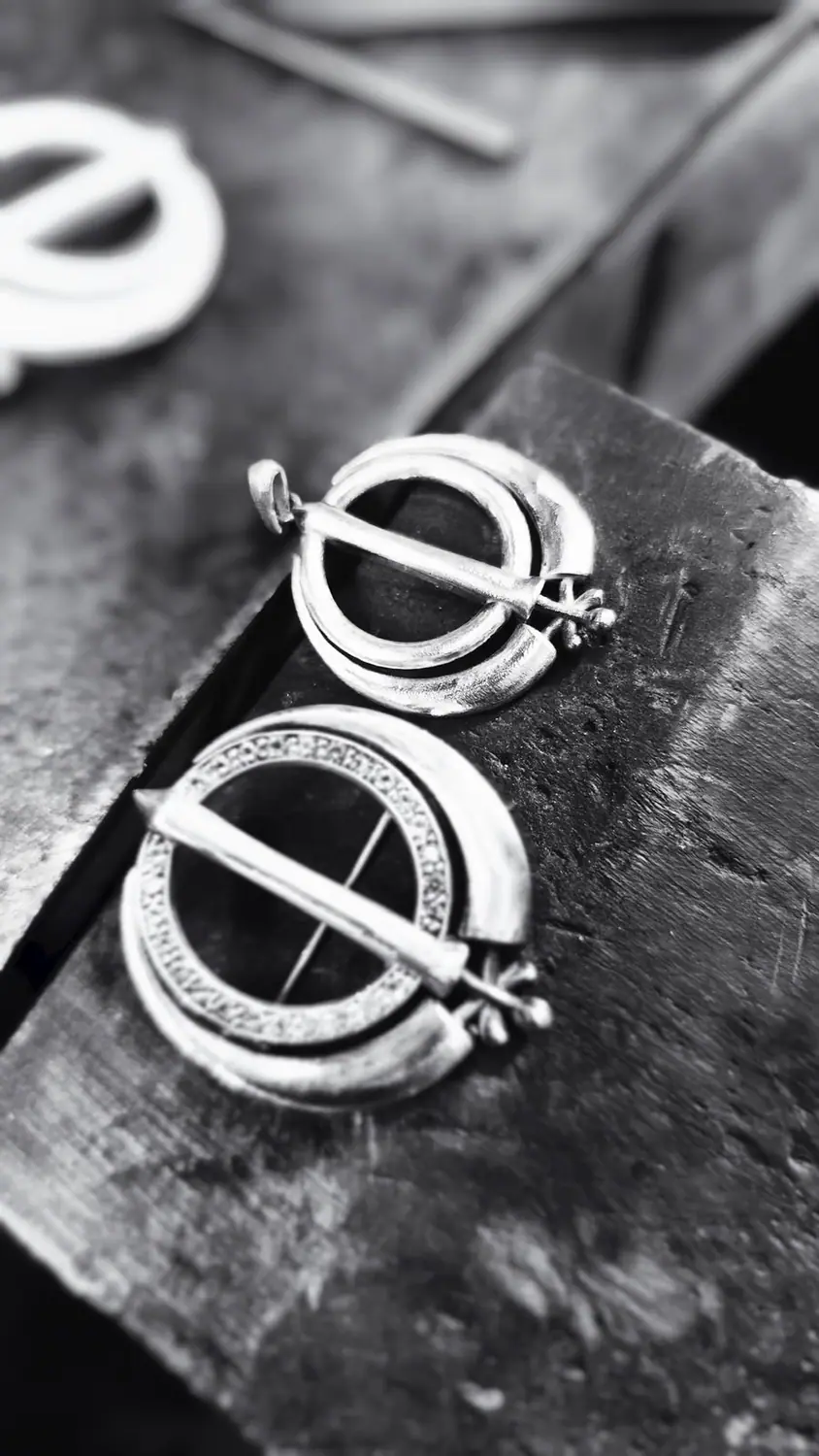 Finished Adi Shakti pendants on a workshop bench
