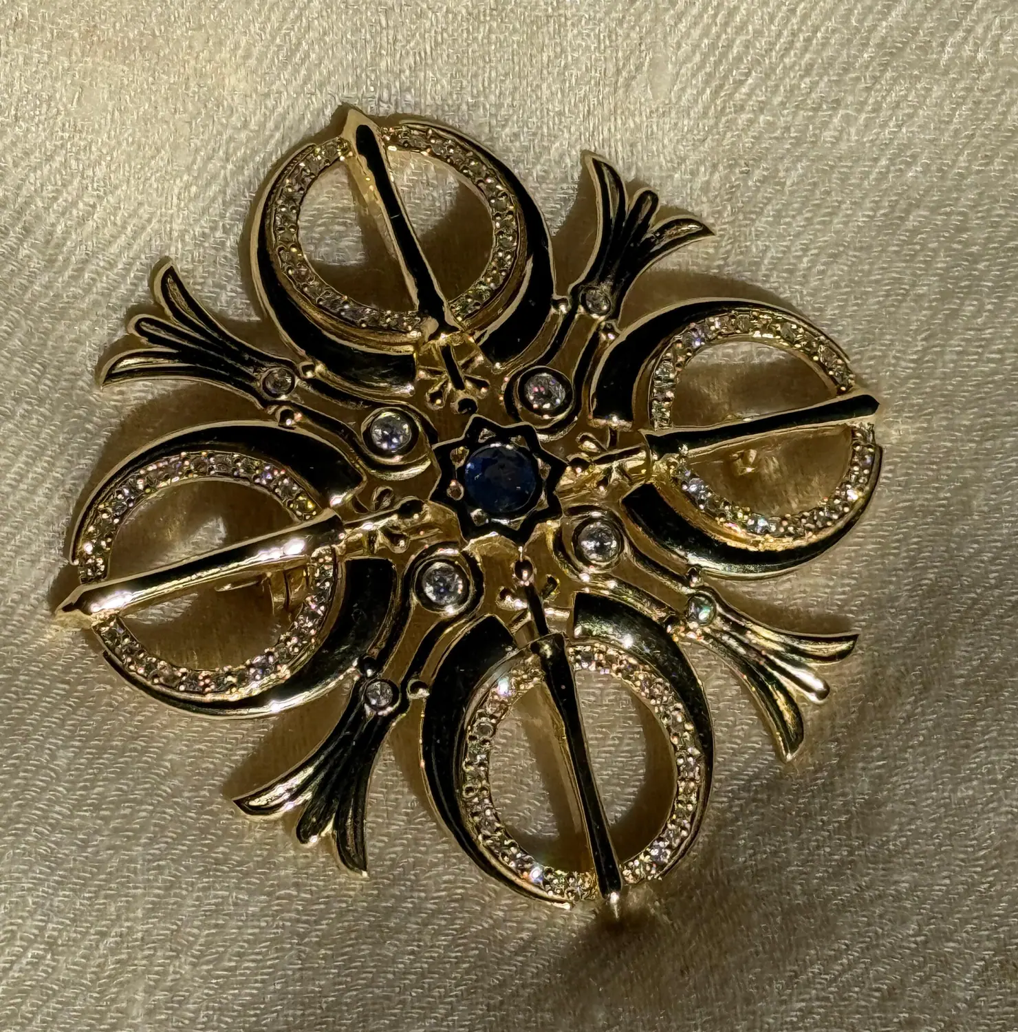 Finished Adi Shakti brooch with black enamel details