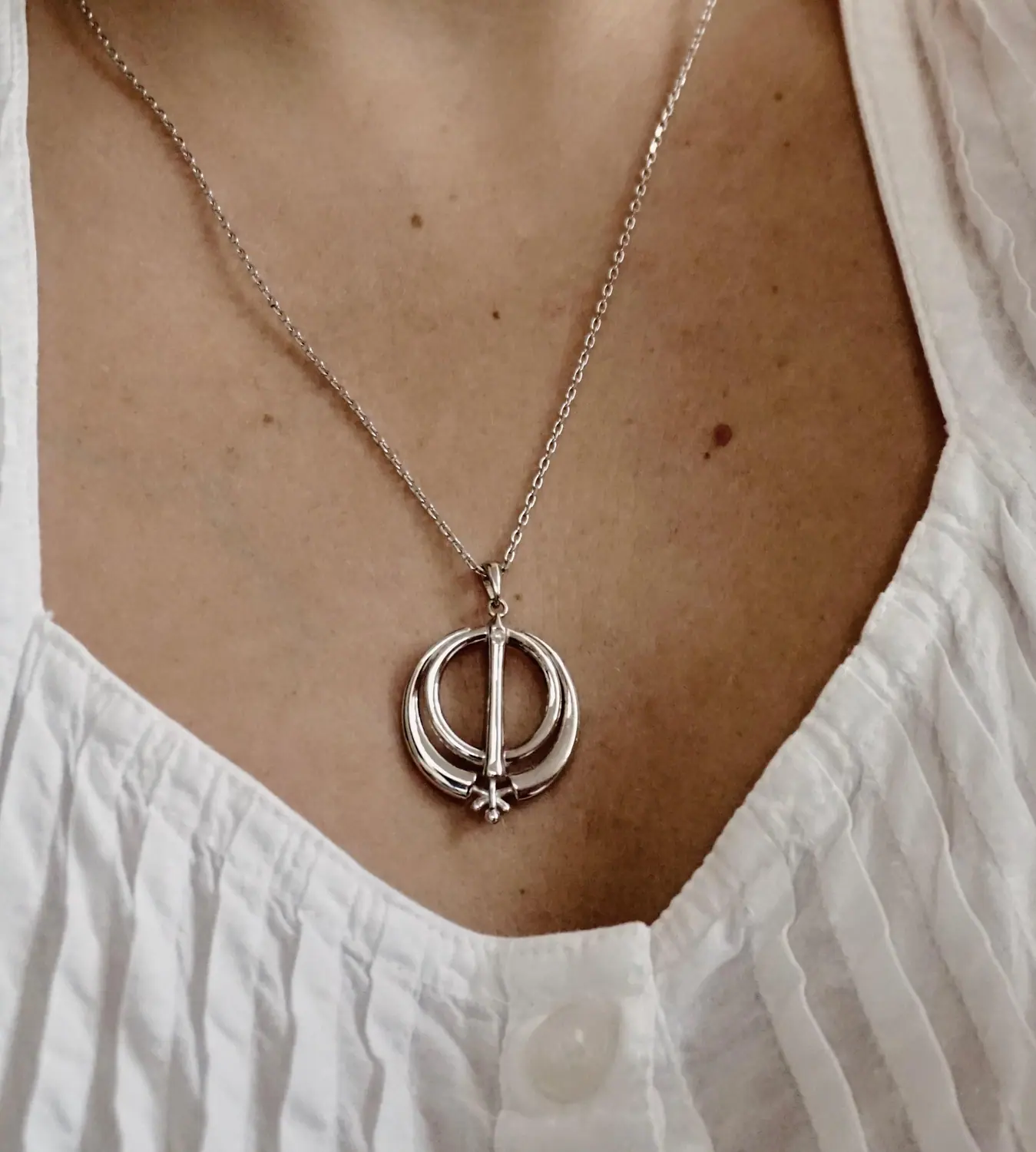 Finished Adi Shakti pendant worn on a silver chain
