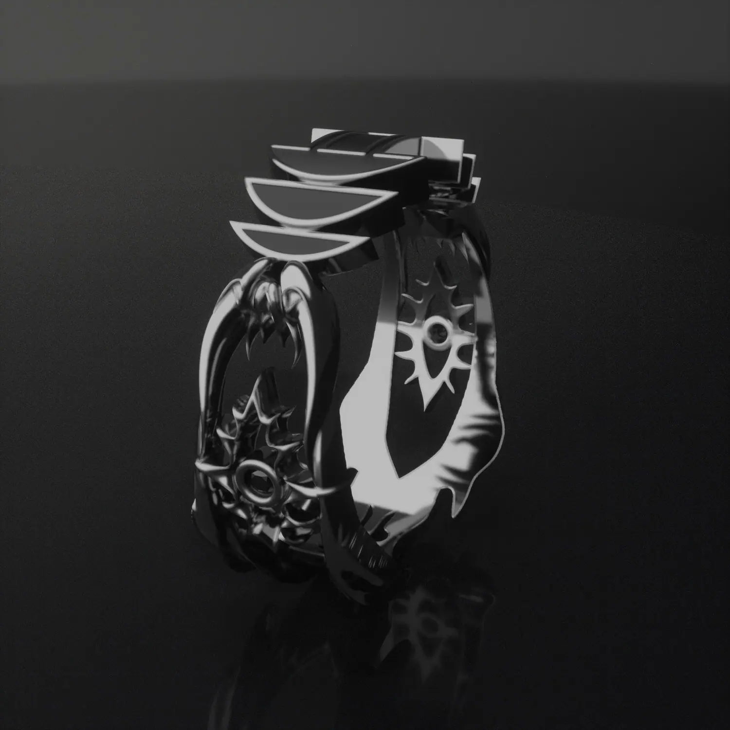 Black and silver ring with winged ornament
