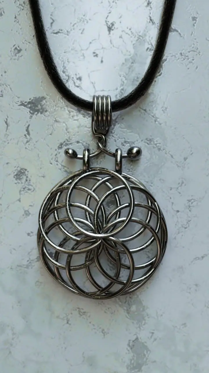 Silver pendant of interlocking circles on a black cord