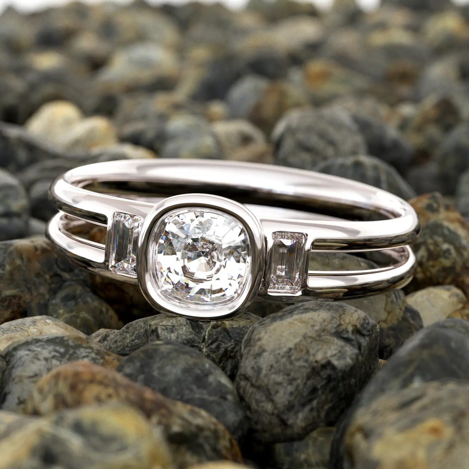 White gold cushion bezel ring with baguette side stones on pebbles
